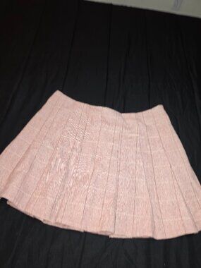 pink/khaki pleated mini skirt with a subtle pattern